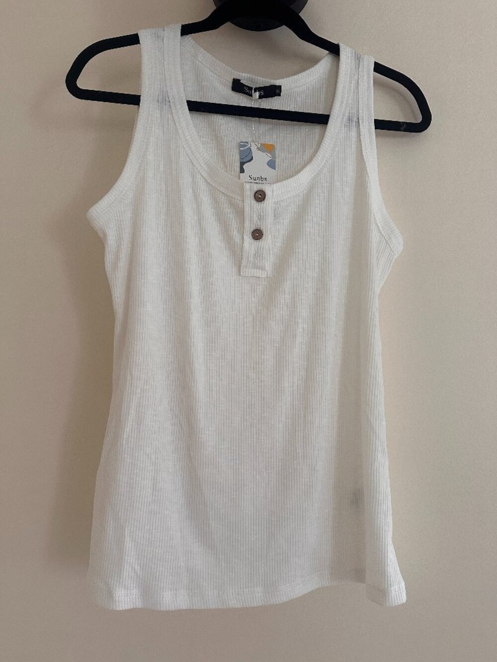 Tank top with buttons.